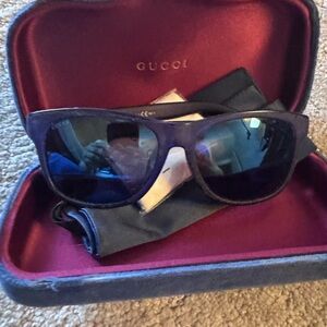 Gucci Men’s Black Frame Sunglasses with Blue Mirrored Lenses